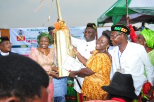 At last the long-awaited Gong has come! Mrs. Payeboye Festus-Lukah, Acting Executive Director, Bayelsa State Council for Arts and Culture Overall Winner of NAFEST 2016 receiving the NAFEST 2016 Presidential Gong presented to Bayelsa State by the Executive Governor of Akwa-Ibom ably represented by Hon. Otuekong Ibiok, Hon. Commissioner for Culture and Tourism, Akwa-Ibom State at the Official Closing Ceremony held on Saturday 8th October, 2016 at the Uyo Township Stadium Uyo, Akwa-Ibom State